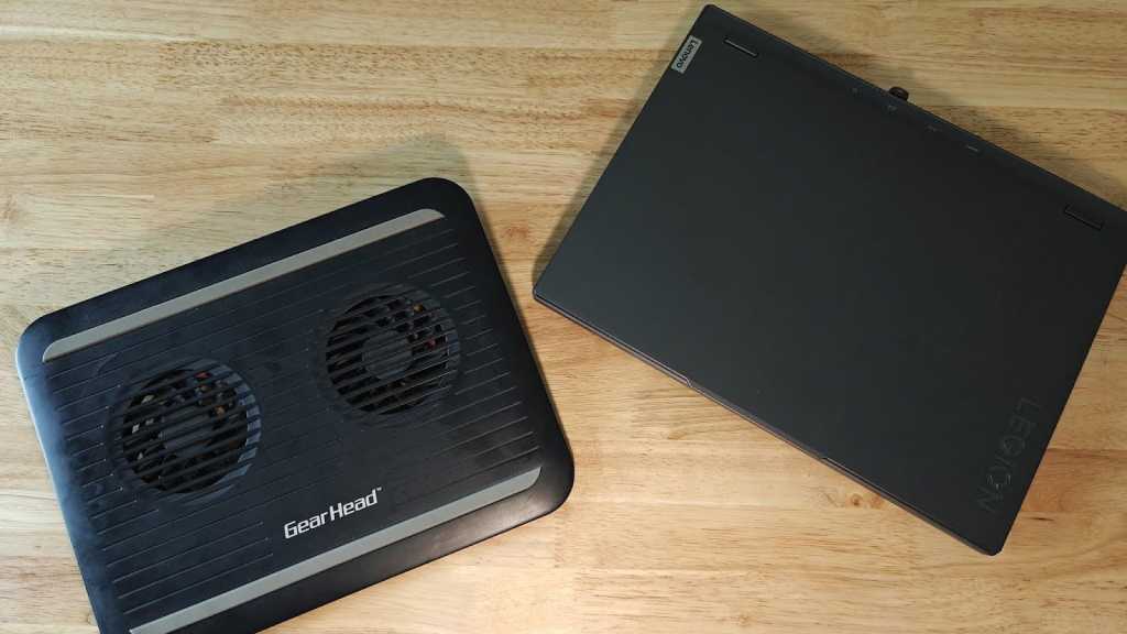 GearHead laptop cooling pad next to Lenovo Legion laptop